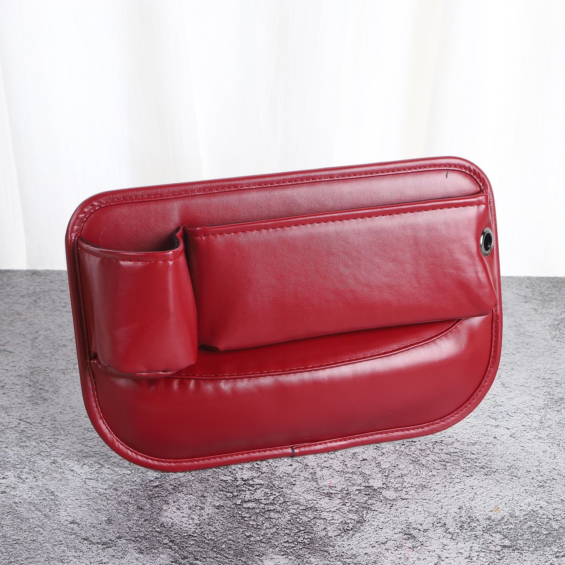 Red car seat gap filler close up